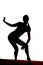 Silhouette woman on toe legs one hand back