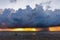 Silhouette woman on the tropical beach on background dramatic storm sky