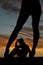 Silhouette womans legs away heels cowboy background
