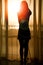 Silhouette of a women near the window on hotel