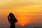 Silhouette women runner listening music and feeling freedom, happy and enjoying nature sunse