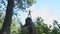 Silhouette wooden snag in the form of pagan idol against the cloudy sky