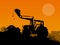 Silhouette of working bulldozer on background