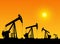 Silhouette of working oil pumps