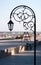 Silhouette wrought park lantern against the beach and sea in sum