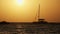 Silhouette Yacht with High Mast Sails at Sunset in the Ocean, Zanzibar, Africa