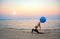 Silhouette yoga ball yung woman in the beach sunset