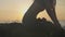 Silhouette yoga practice at sunset. Yong woman doing yoga exercise on the beach