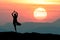 Silhouette Yoga practitioner during twilight sunset meditation with Omega sunset or Inferior-Mirage Sunset