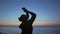 Silhouette yoga woman reaching for evening sky close up. Girl raising up hands.