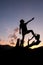 silhouette of a young boy on a log Surrounded by shadows of mountains Atit falls in the evening feeling refreshed after exercise