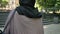 Silhouette of young calm muslim girl in hijab walks up stairs in park in daytime in summer, religious concept, urban