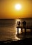 Silhouette of young couple enjoying beautiful sunset at beach. Romantic moment human relationship