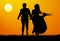 Silhouette of a young couple at sunset. Vector illustration