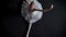 Silhouette of young elegant woman ballerina sits on splits, stretching concept, ballet concept, top shot