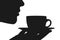 Silhouette of a young female with a cup of drink on a saucer