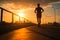 A silhouette of a young fitness enthusiast jogging against a stunning sunrise