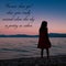 Silhouette of a young girl standing on a beach with a beautiful quote