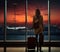 Silhouette of a young girl with a suitcase standing at the airport window. The evening light of sunset. Generated by AI.