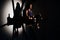 Silhouette of young gorgeous african-american woman fitness instructor working out at the gym