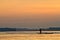 Silhouette of young man in a canoe along the Napo