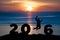 Silhouette young man jumping on the sea and 2016 years while celebrating new year