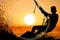 Silhouette of Young Man Kite Boarding at sea