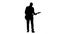 Silhouette of a young man playing the guitar. Slow motion