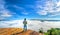 Silhouette young man standing on a high hill scenic rural hometown