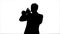 Silhouette Young musician playing trumpet