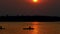 Silhouette of young people in kayaks on minnesota lake