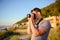 Silhouette of young photographer on the beach