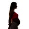 Silhouette of a young pregnant woman isolated on a white. Beauty and tender motherhood