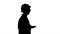 Silhouette Young scientist in lab coat and hardhat walking and s