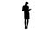 Silhouette Young secretary holding a tablet and talking to the camera