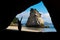 Silhouette of a young traveler woman enjoying in the marvelous landscape of Cathedral cove, Coromandel Peninsula, North Island,