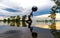 Silhouette young woman lifestyle exercising vital meditate and practicing reflect on water Flood the tree in the reservoir, backgr