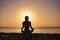 Silhouette young woman practicing yoga on the beach at sunset, Karon Beach ,Phuket ,Thailand. For background and texture