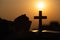 Silhouette of young woman praying with crosses and bibles at sunrise, Christian Religion concept background