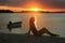 Silhouette of young woman at sunset, Boca Chica bay