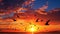 silhouetted birds in flight against a stunning sunset sky