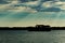 silhouetted boats against a beautiful sky