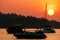 Silhouetted boats at sunrise on Ao Ton Sai, Phi Phi Don Island, Krabi Province, Thailand