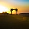 Silhouetted chuppah at a Jewish wedding at sunset