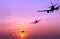 Silhouetted commercial airplane flying