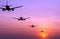 Silhouetted commercial airplane flying