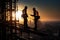 Silhouetted construction workers on scaffolding with city backdrop during a mesmerizing sunset.