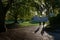 A silhouetted couple walk towards iconic greenhouses of sheffield