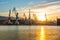 Silhouetted cranes at shipyard,