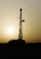 Silhouetted Drilling Rig at a Desert Location